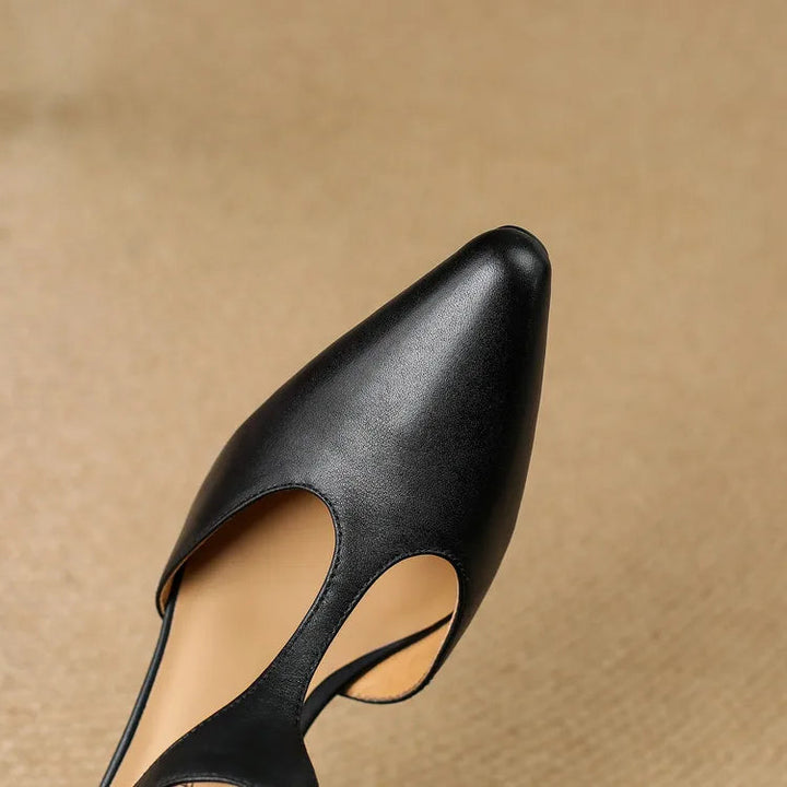 Detail shot of the heel on women's vintage T-strap dress shoes, showing stability and classic design.
