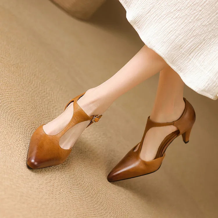 Versatile black vintage T-strap heels for women, ideal for formal wear, dress shoes, or special events.