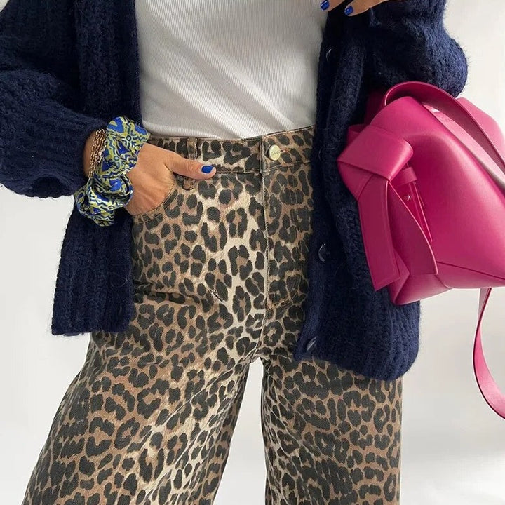 Women's high waist leopard print jeans, a trendy statement piece for casual or dressed-up vintage fashion outfits.