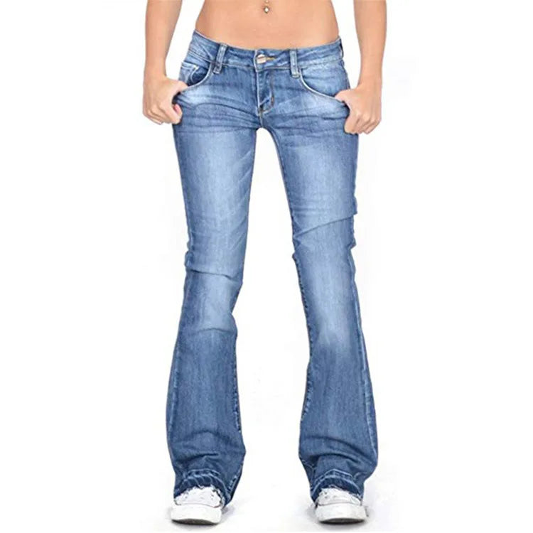 Woman walking in dark blue low-rise flared jeans, embodying retro chic comfort and everyday wear.