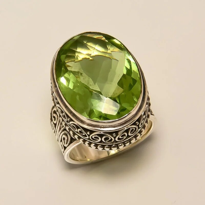 Women's vintage olive green crystal ring with gold plated band, an elegant fashion statement jewelry piece for her.
