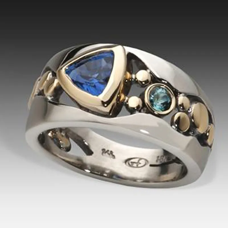 Women's vintage silver ring with a striking blue gemstone. Elegant classic jewelry accessory for women.