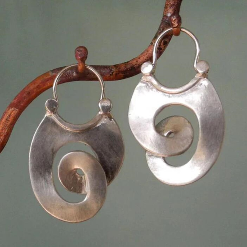 Women's vintage silver spiral drop earrings. Elegant artistic fashion jewelry.
