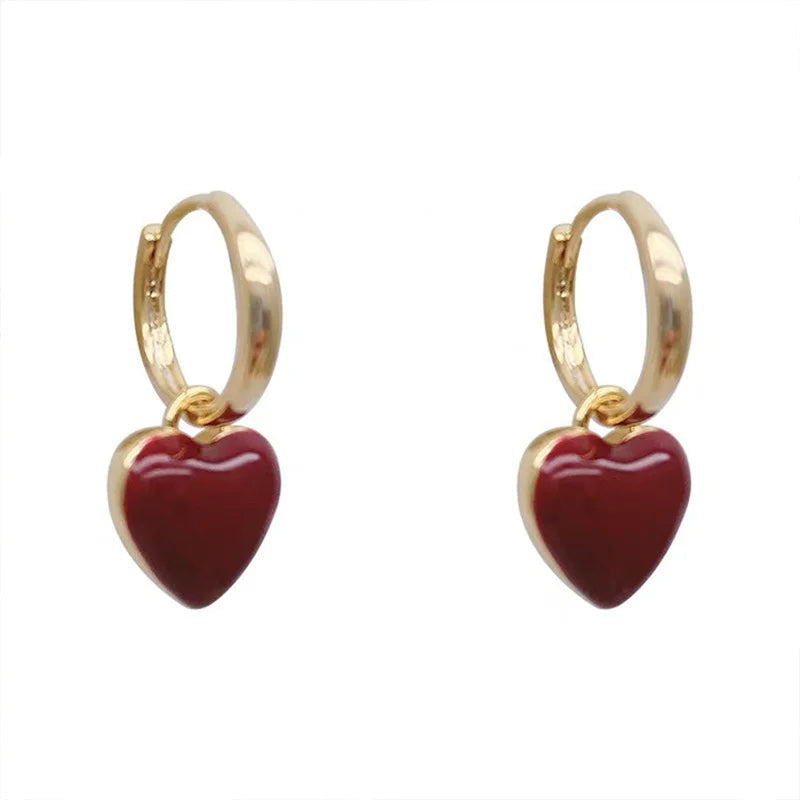 Stylish gold plated vintage split heart drop earrings for women. Romantic, eye-catching statement jewelry.