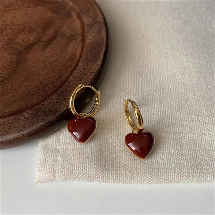 Gold plated vintage split heart drop earrings. Unique romantic jewelry, ideal for women's special occasions.