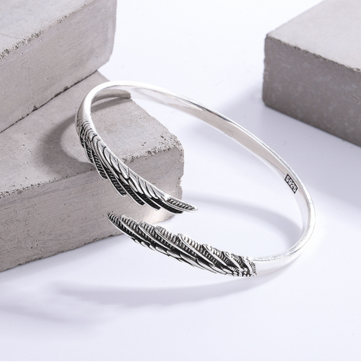Women's vintage sterling silver feather bracelet, adjustable cuff, perfect boho jewelry and fashion accessory.