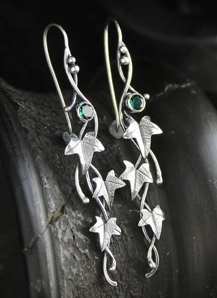 Women's vintage sterling silver leaf dangle earrings, elegant and classic jewelry.