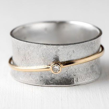 Women's vintage sterling silver ring with elegant gold lines and sparkling zirconia. Perfect elegant jewelry.