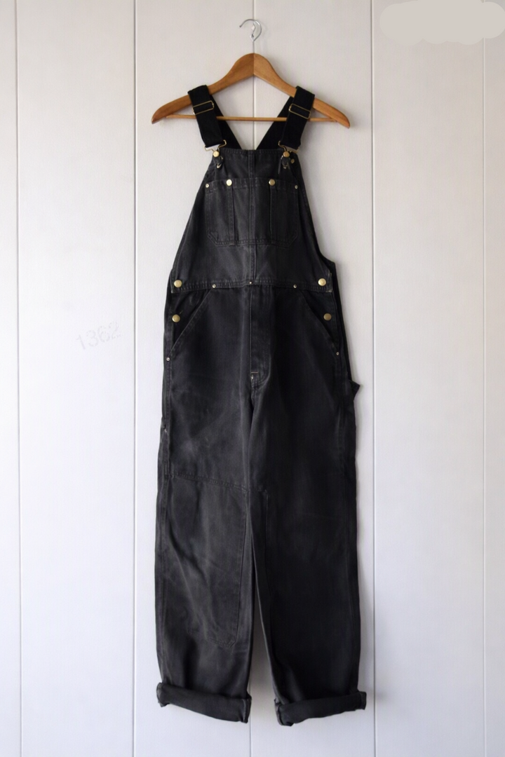 Women's vintage bib overalls, adjustable straps, durable denim, relaxed fit for everyday comfort.