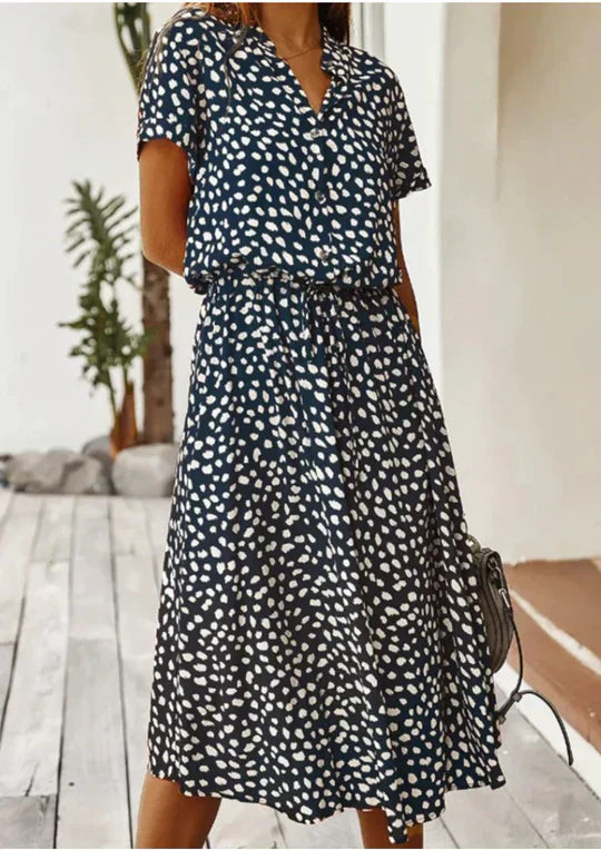 Chic women's vintage summer dress, midi length with graceful three-quarter sleeves & a flowy silhouette.
