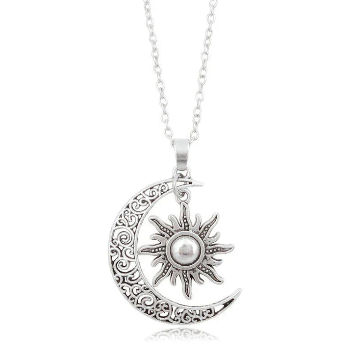 Woman wearing a beautiful vintage sun and moon necklace, a striking celestial statement piece for her jewelry collection.