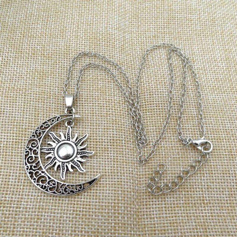 Giftable vintage sun and moon necklace for women. Celestial jewelry with an adjustable chain, stainless steel design.