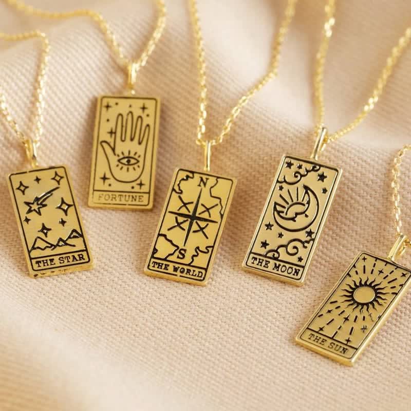 Women's vintage tarot card pendant necklace, mystical symbolic jewelry accessory.