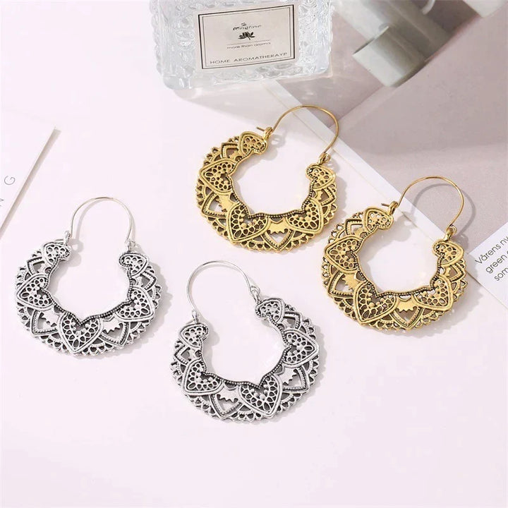 Women's vintage totem drop earrings. Elegant gold & silver fashion accessory, unique design statement jewelry.