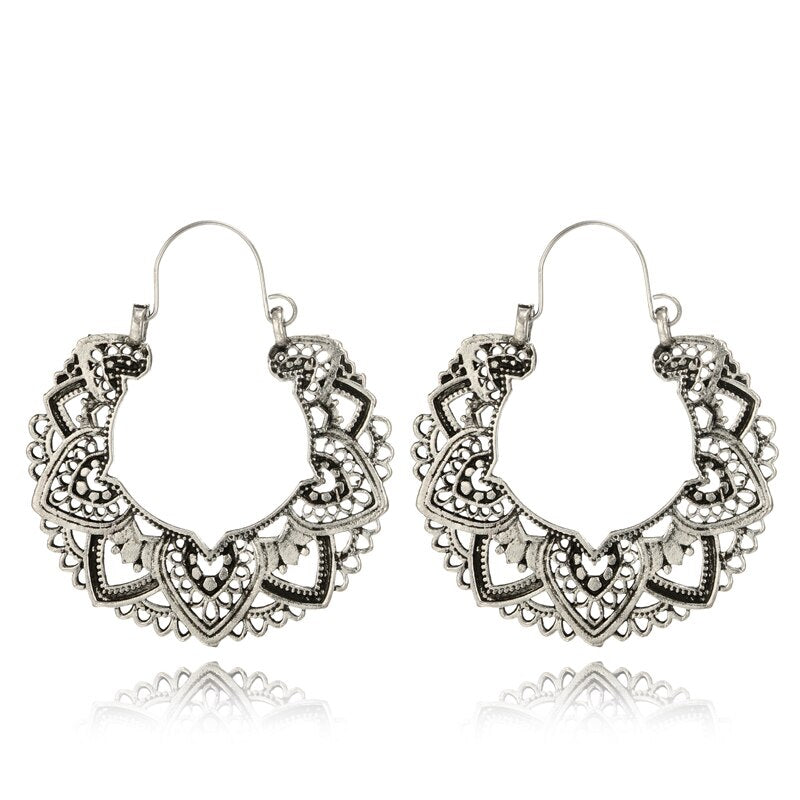 Stylish vintage totem drop earrings for women. Unique gold & silver jewelry, an elegant fashion accessory.