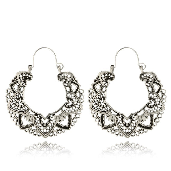 Stylish vintage totem drop earrings for women. Unique gold & silver jewelry, an elegant fashion accessory.