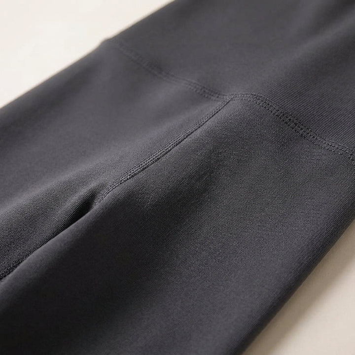 Close-up of the supportive high waist band on Vivian women's stretch sports leggings, black fabric detail