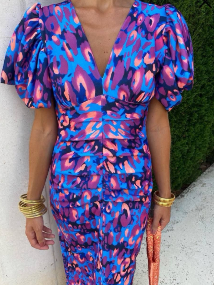 Stylish women's vivid ruched midi dress with sculpted shoulders, a flattering choice for formal celebrations.