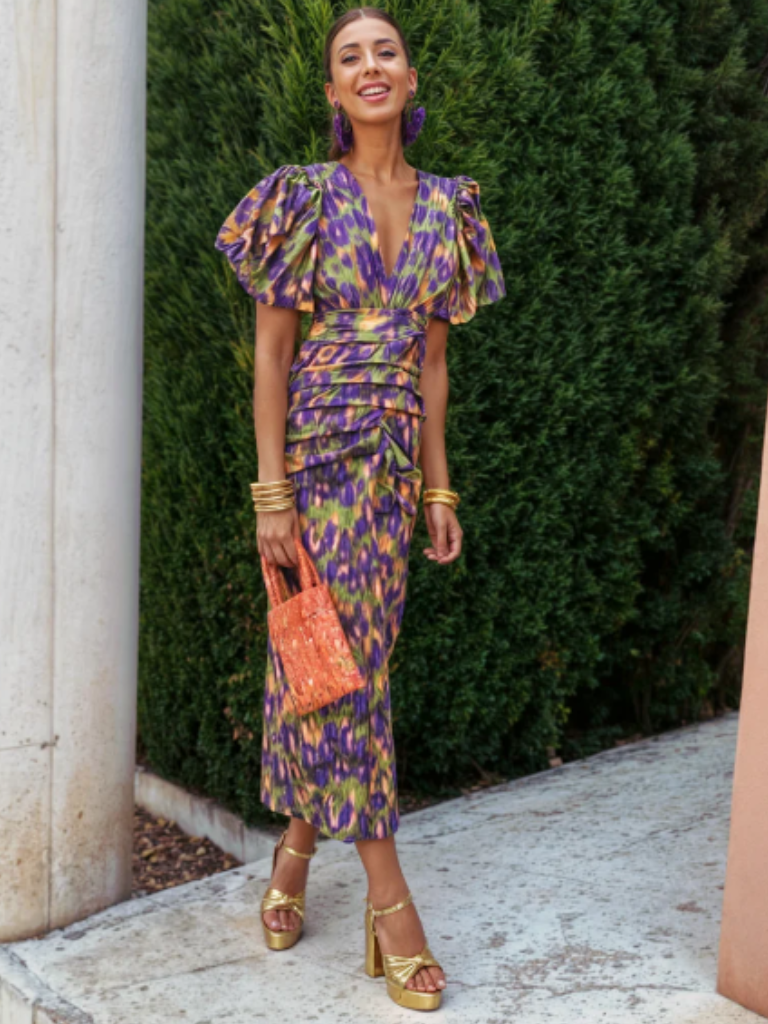 Chic women's midi dress, ruched for a flattering silhouette, vivid color, & unique sculpted shoulders. Evening wear.