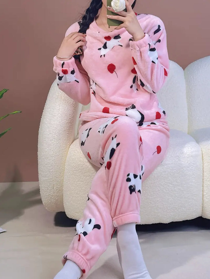 Cozy women's printed fleece pajama set, providing warmth and comfort for cold winter nights & relaxing loungewear.