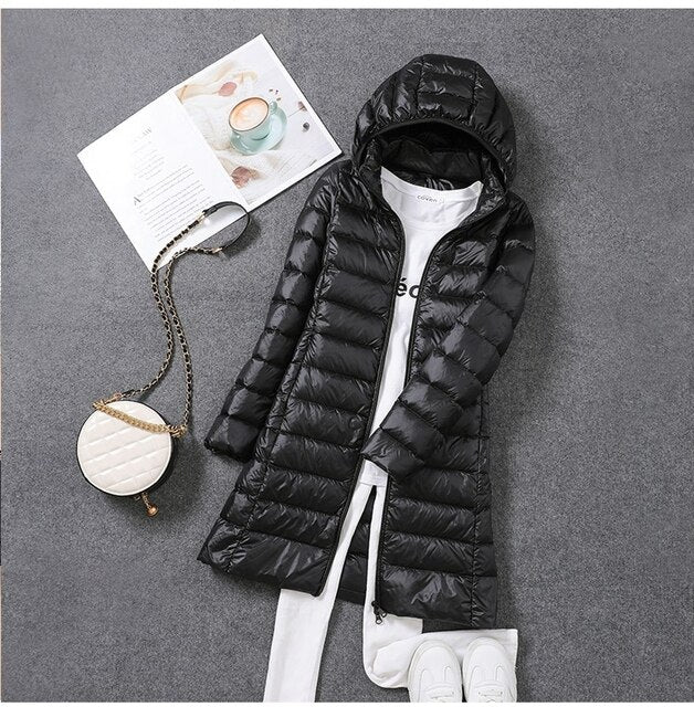Cozy women's puffer coat with hood, perfect for fall fashion & severe winter. Warm, comfortable seasonal outerwear.