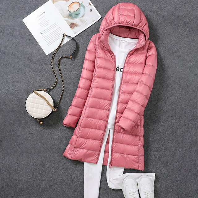 Elegant women's hooded puffer coat, a cozy fashion jacket. Perfect for warm winter comfort & seasonal outerwear.