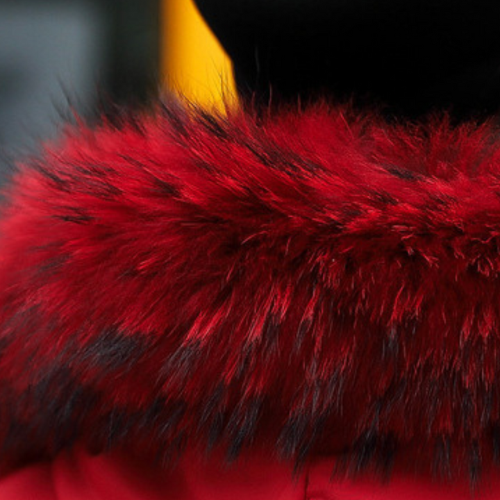 Insulated women's hooded puffer jacket with faux fur, perfect warm winter coat.