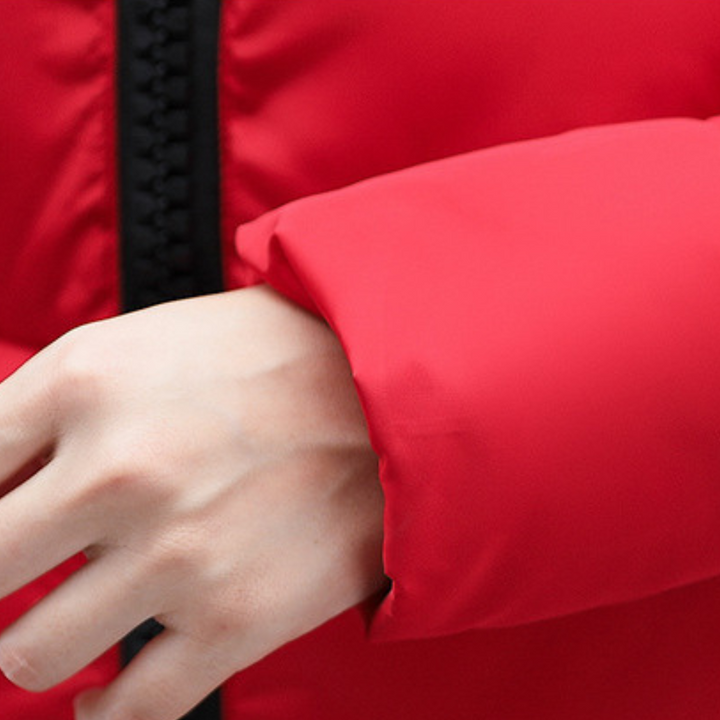 Ultra-warm women's hooded puffer jacket, insulated for extreme winter cold.