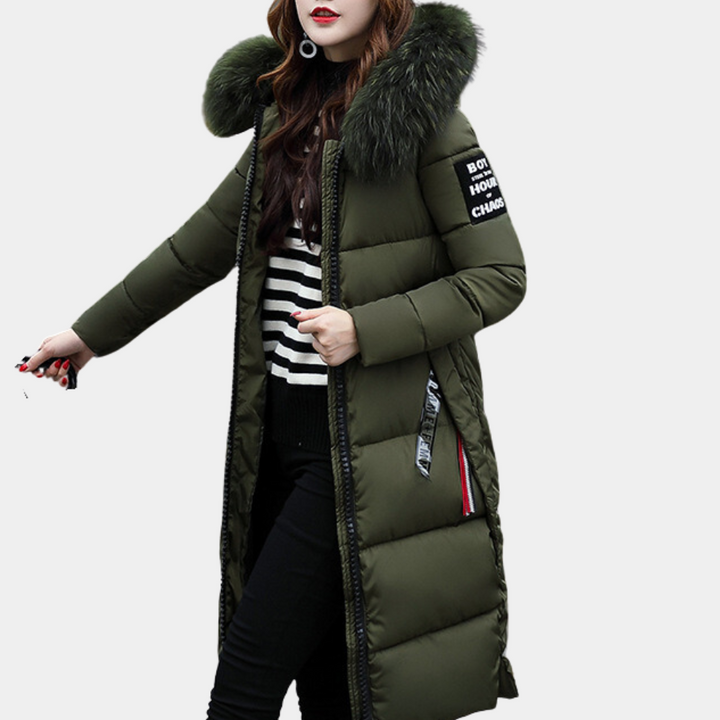Woman wearing a stylish hooded puffer jacket, ready for cold weather activities.