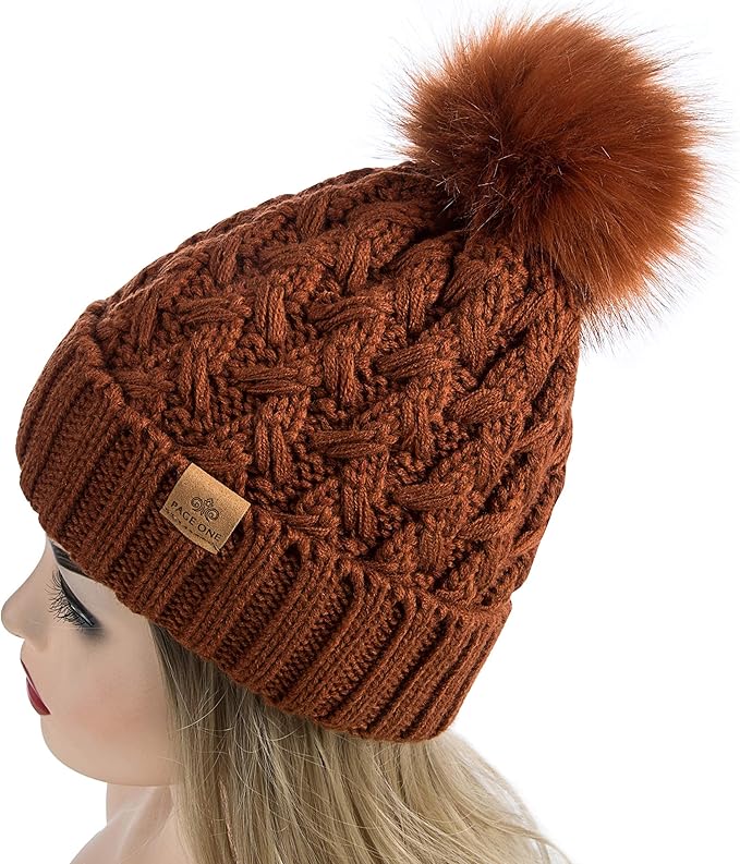 Woman smiling while wearing the stylish Yvonne warm knit pom beanie, enjoying the cold weather.