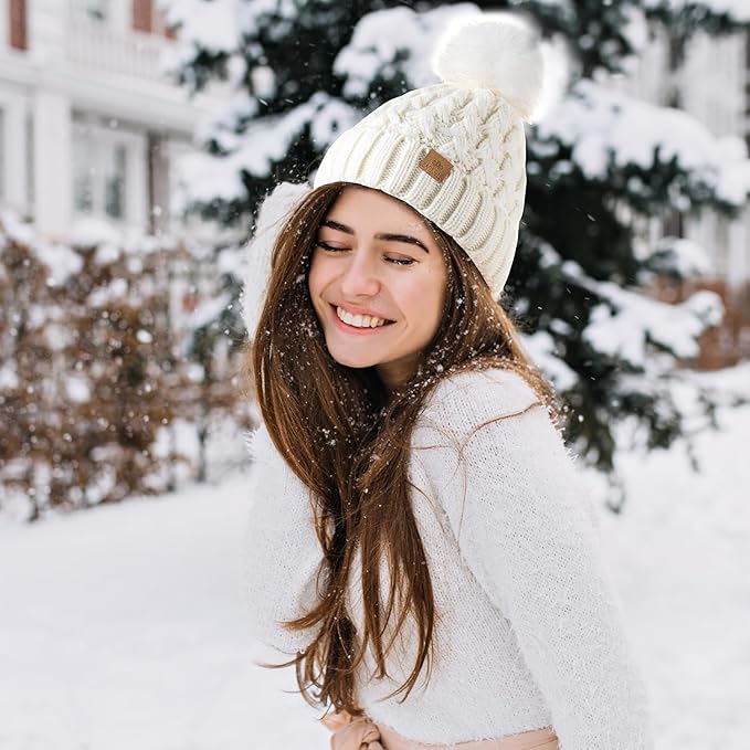 A cozy, thick Yvonne knit pom beanie hat, providing ultimate warmth for women in winter.