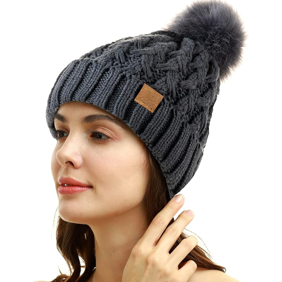 Detail of the cable knit pattern on the Yvonne women's winter hat, a classic accessory.