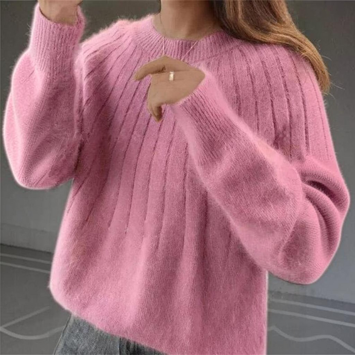 Long sleeve women's knitted sweater in soft cashmere, providing warmth and elegant style for cold weather.