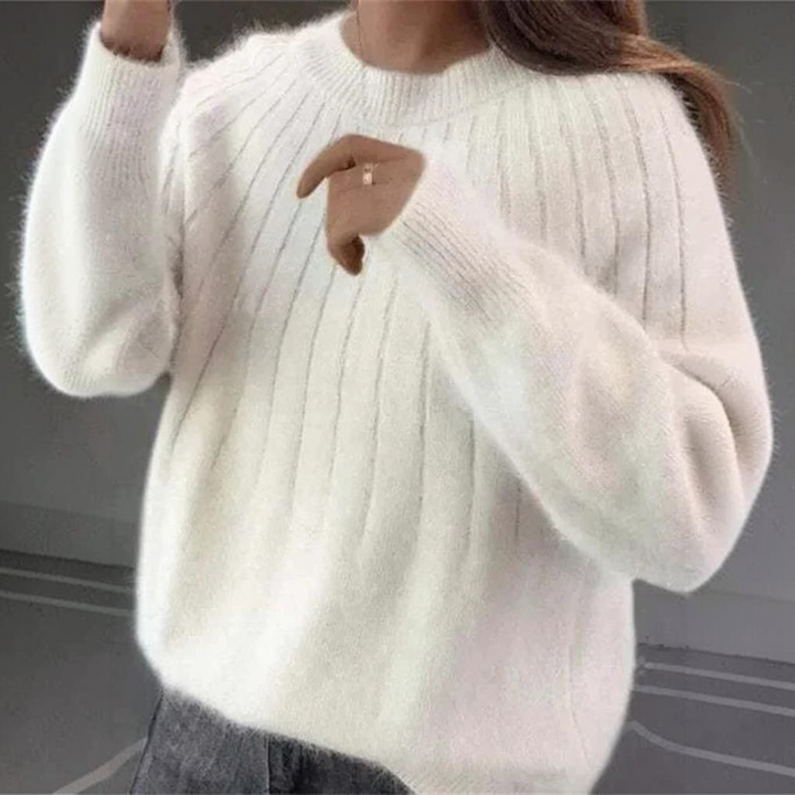 Women's warm long sleeve knitted sweater, made from soft cashmere for ultimate comfort in fall and winter.