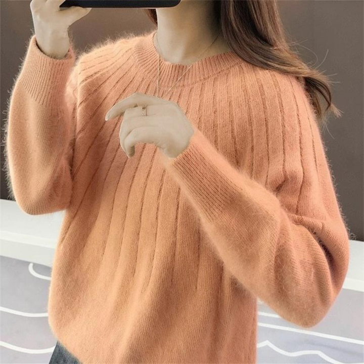 Elegant women's cashmere knitted sweater, a versatile and cozy long sleeve top for luxury fall and winter style.