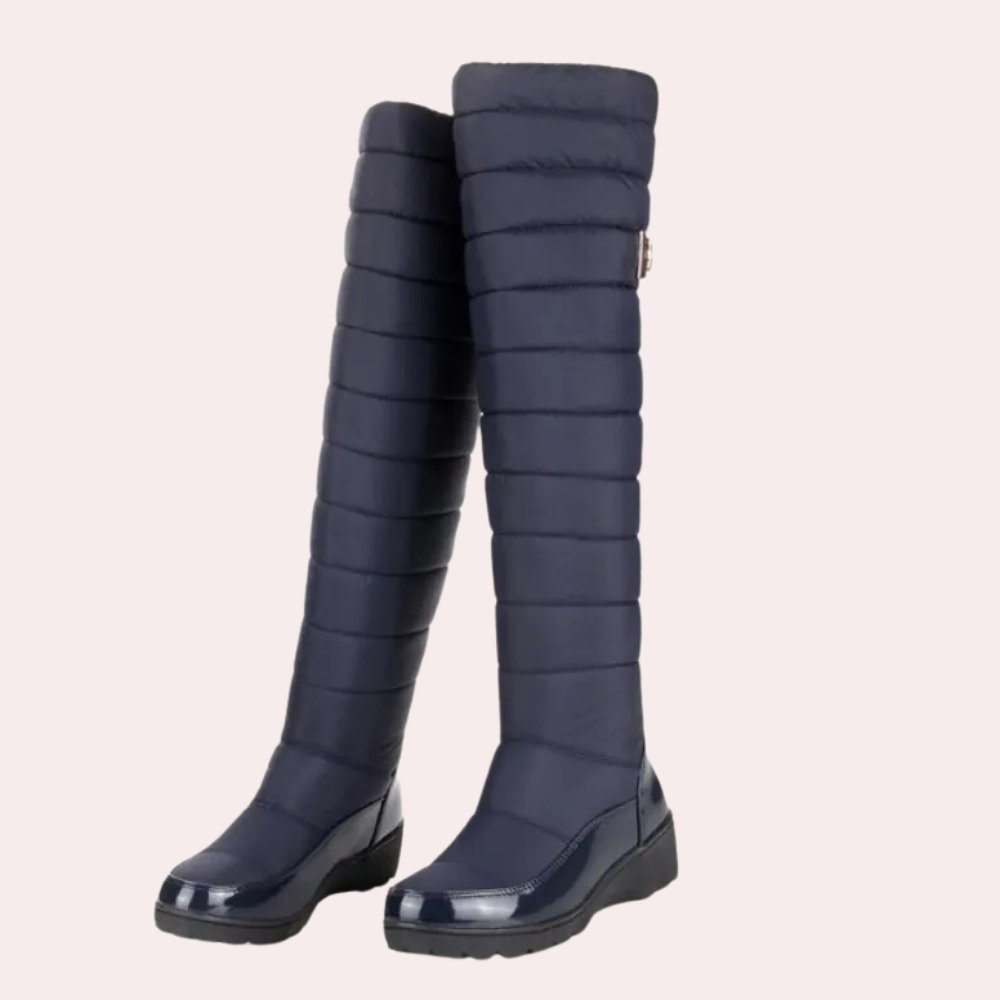 Elegant navy over-the-knee boots, providing ultimate warmth & comfort for women's cold weather winter style.