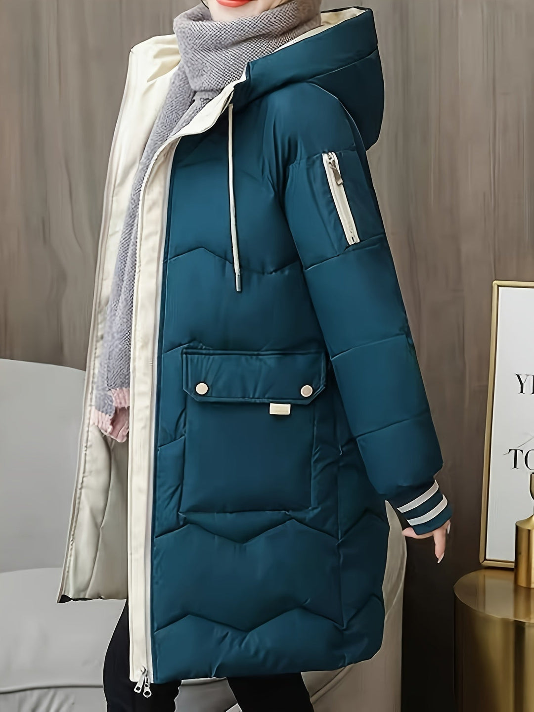 Super warm women's quilted hoodie jacket, zip-front, essential for cold weather.