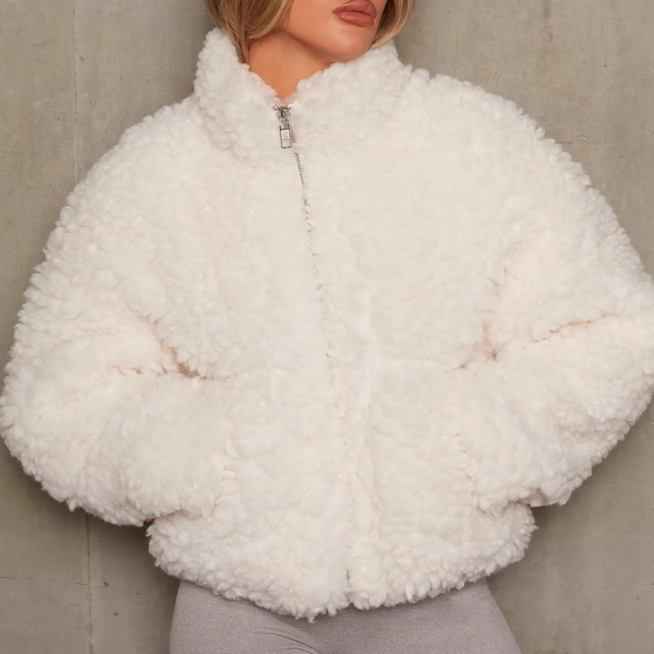 Fashionable women's velvety winter coat. Soft velvet feel, warm long-sleeve jacket for cold weather style.
