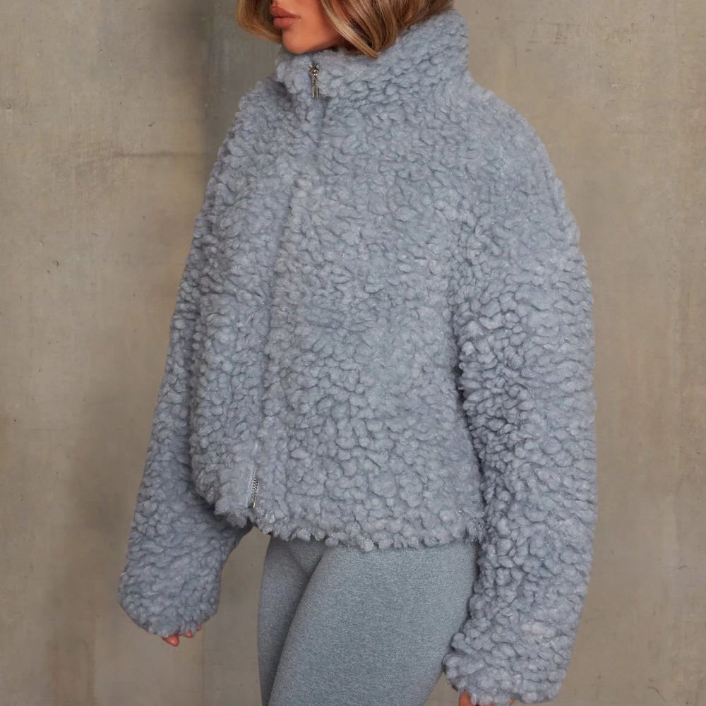 Elegant women's warm winter coat with a soft velvety feel. Long-sleeve outerwear, ideal for cold weather comfort.