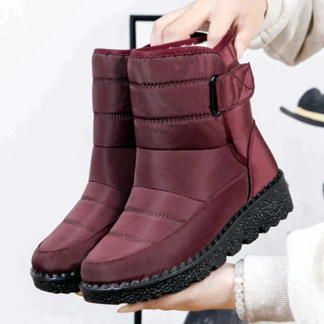 Women's non-slip waterproof winter boots for snow, offering comfort & warmth in cold weather activities.