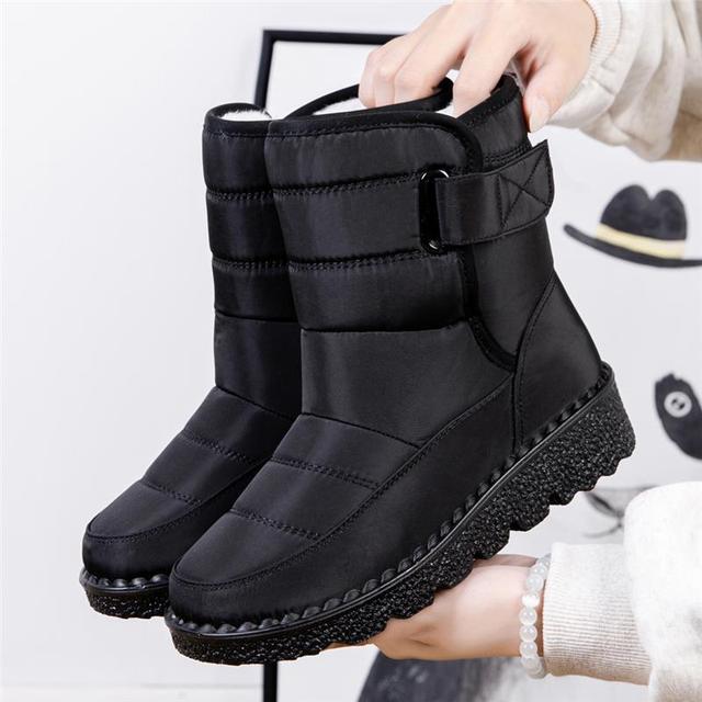 Black women's fashion winter boots, waterproof, warm, & padded. Essential ladies footwear for cold days.