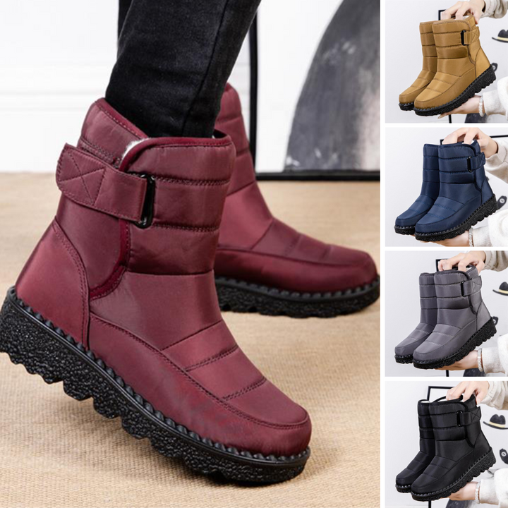 Warm padded women's winter boots with waterproof exterior, ensuring comfort & protection in extreme cold.