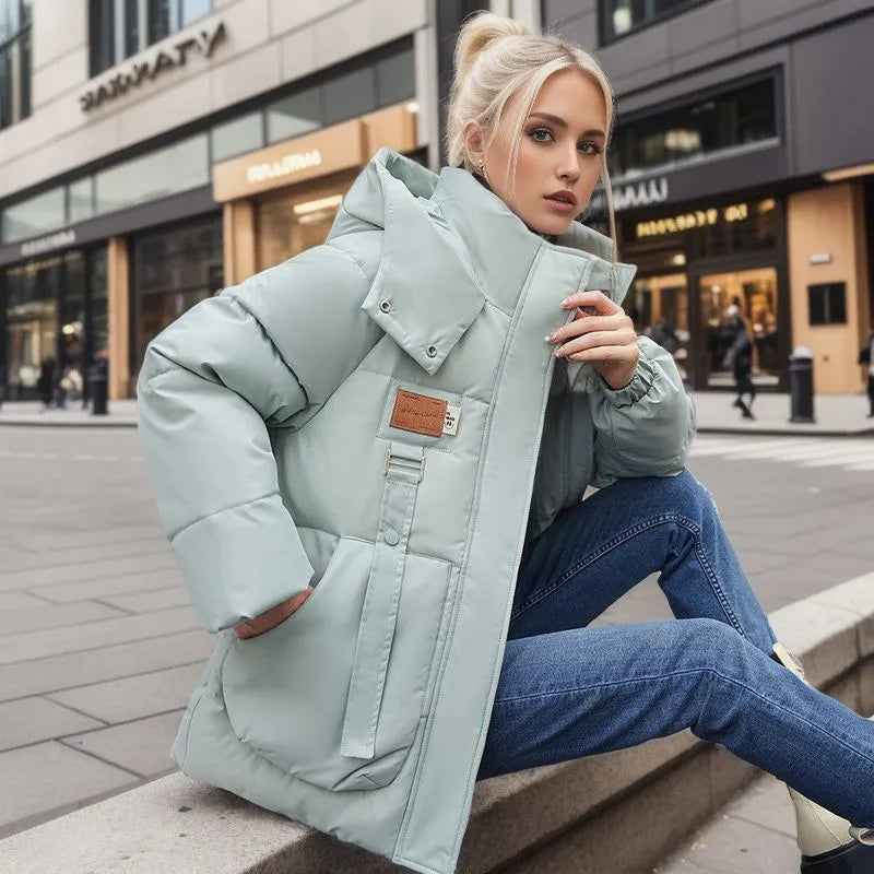 Women's warm winter parka coat with hood, ideal for stylish and cozy cold weather outerwear.