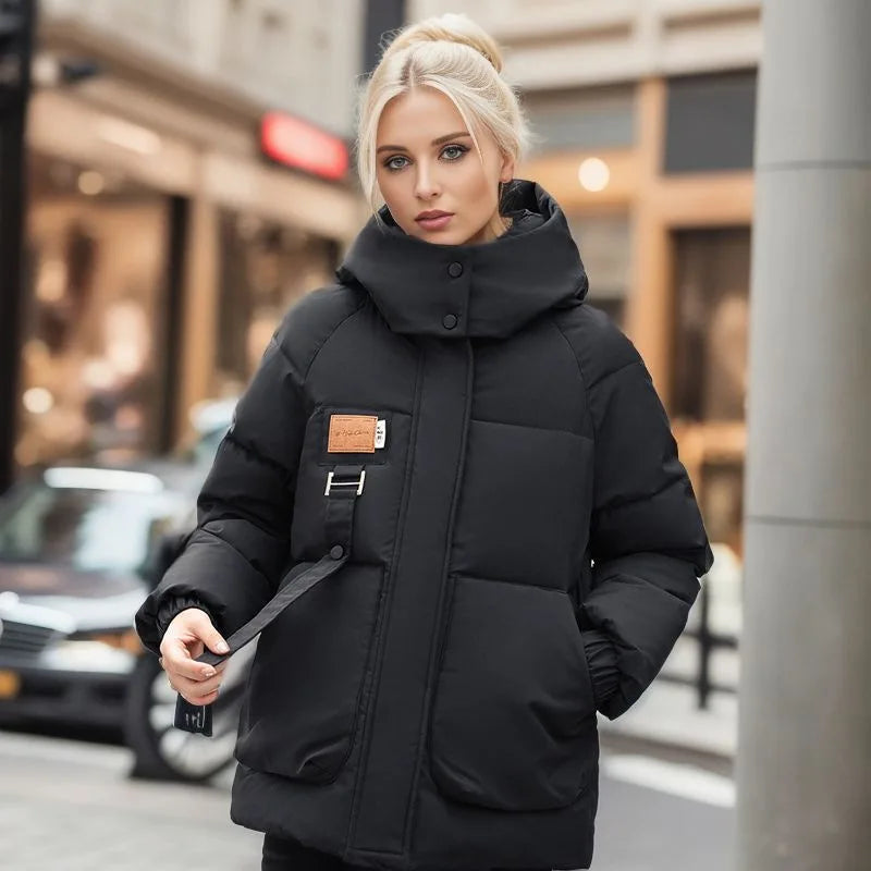 Cozy black women's winter parka coat, a warm and fashionable hooded outerwear for cold weather.