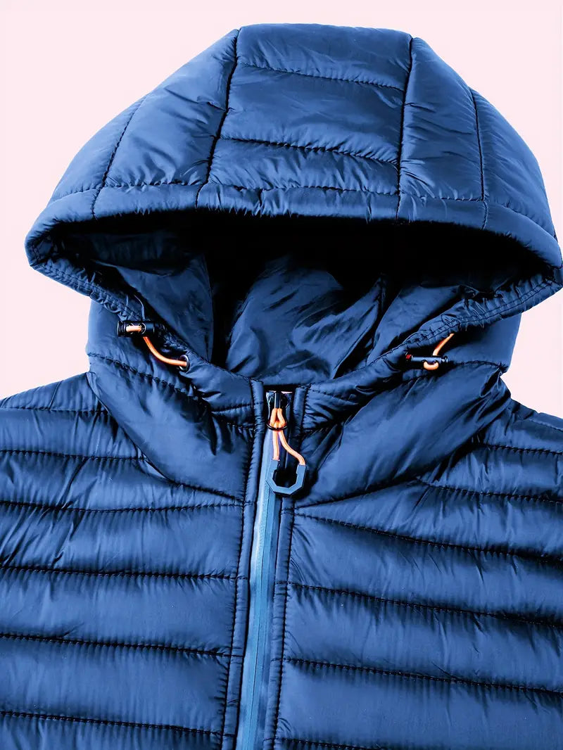 Women's active wear hooded puffer coat, insulated and lightweight, for outdoor adventures.