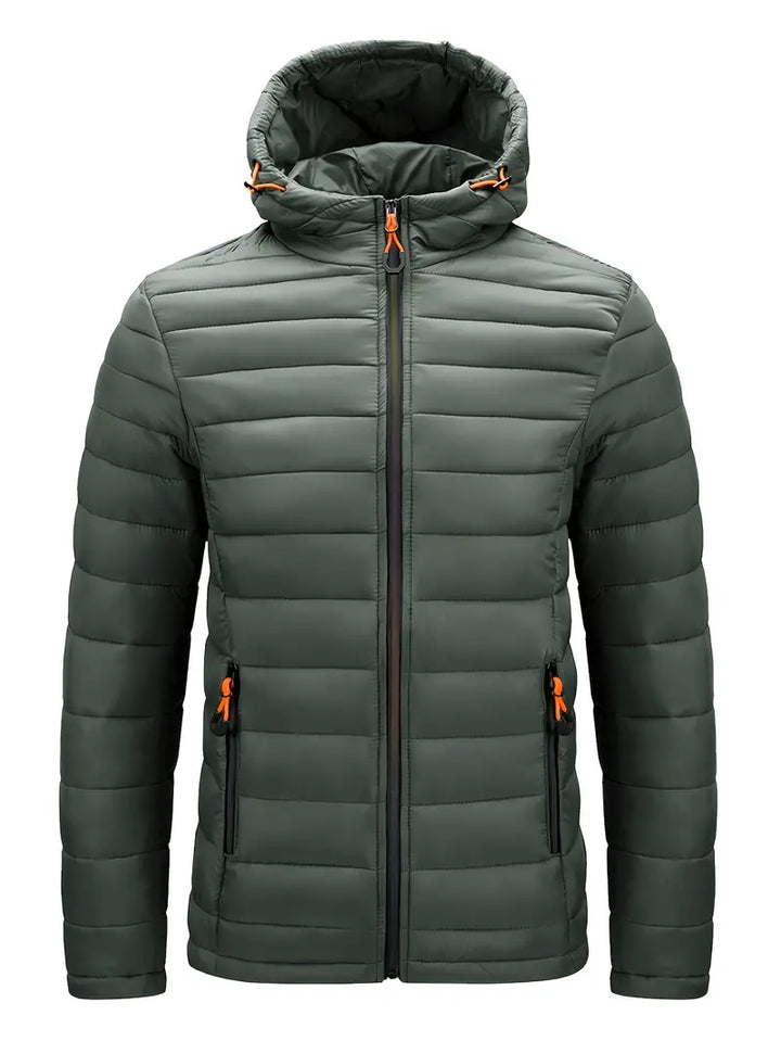 Warm women's winter jacket, puffer style with hood, suitable for snowy conditions.