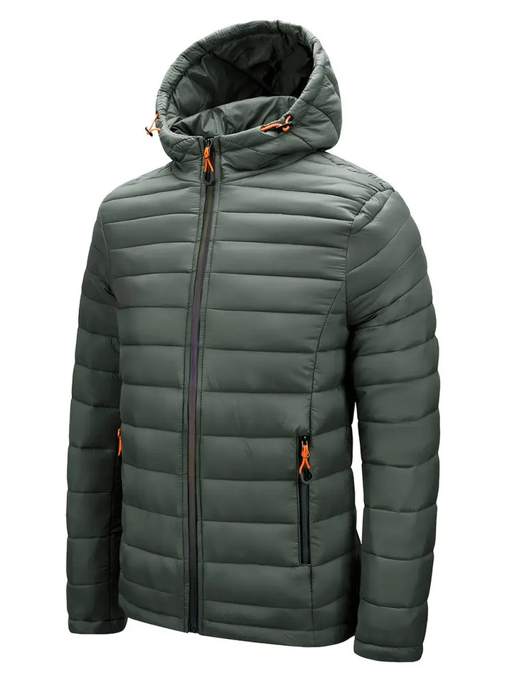 Lightweight women's insulated puffer jacket with hood, perfect for travel and packing.