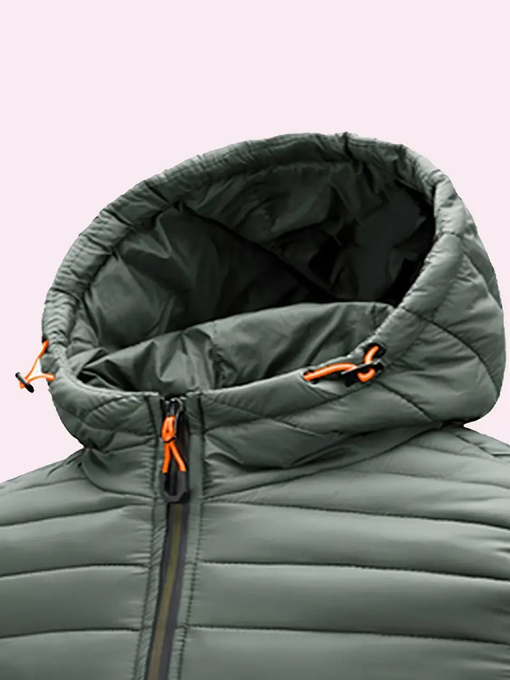 Women's warm winter puffer jacket, front view, showcasing hood and sturdy zipper closure.