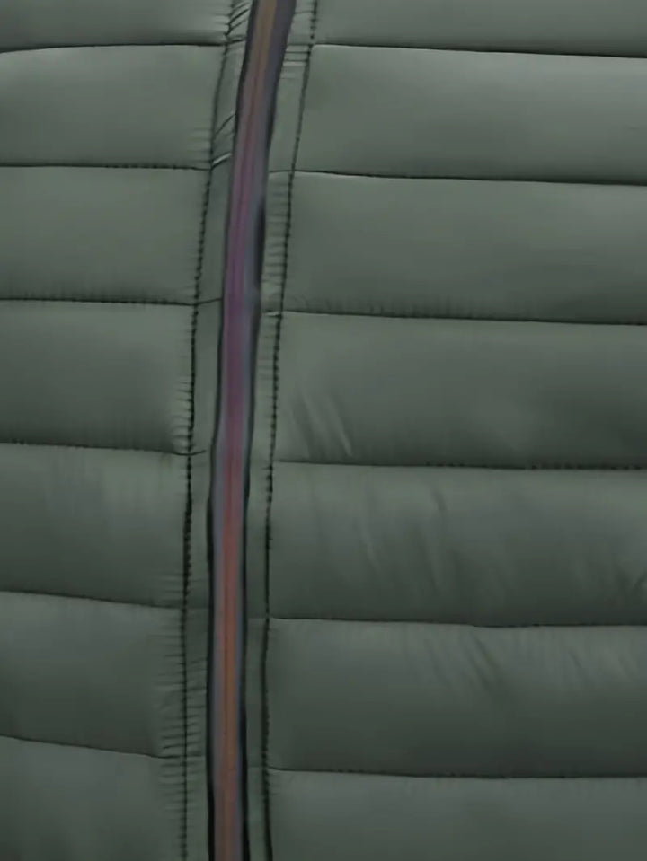 Back view of women's warm puffer jacket with hood, in black, highlighting quilted details.