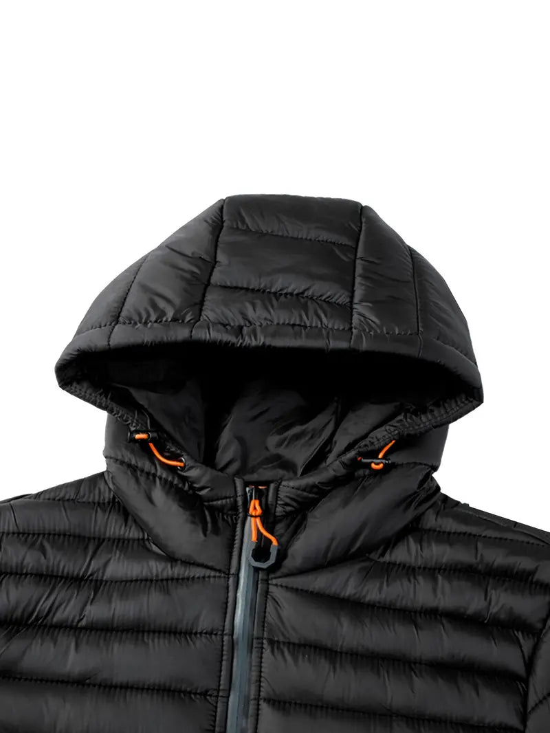 Warm quilted winter jacket for women, with a practical hood, designed for comfort.
